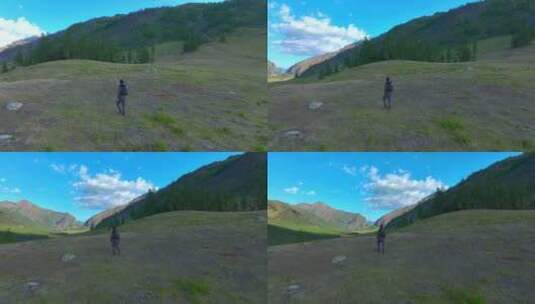 男人行走在阿勒泰山脉高清在线视频素材下载
