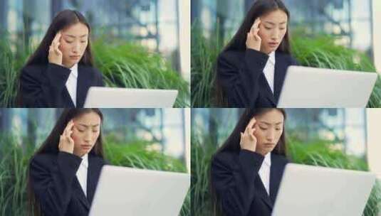 疲惫的年轻亚洲女商人办公室职员坐在城市公高清在线视频素材下载