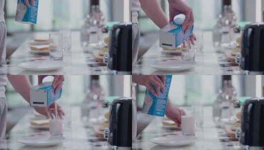 唯美高级感镜头早餐往杯子里倒牛奶高清在线视频素材下载