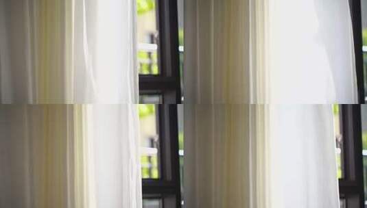 风吹窗帘窗户白色窗帘飘动阳光透过白色窗帘高清在线视频素材下载