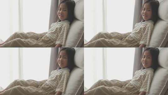 窗边女孩甜美笑容高清在线视频素材下载