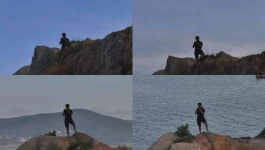 平潭岛站在石头顶上的男子高清在线视频素材下载