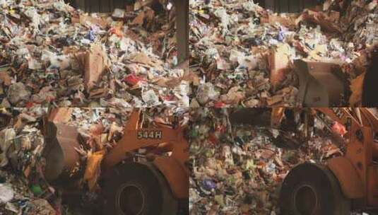 铲车清理可回收垃圾的镜头高清在线视频素材下载