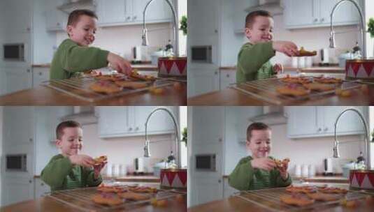 男孩拿起饼干吃一口高清在线视频素材下载