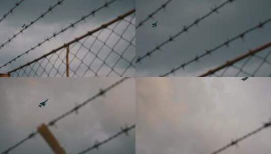 铁网上的战斗机飞行高清在线视频素材下载