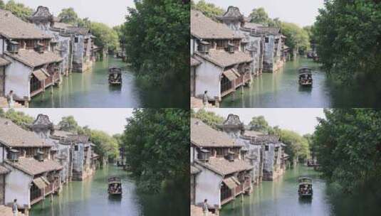 （慢镜头）江南水乡乌镇乌篷船河中前行高清在线视频素材下载