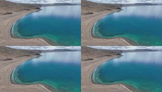 航拍西藏拉萨纳木措北岸渐变蓝湖水景观高清在线视频素材下载