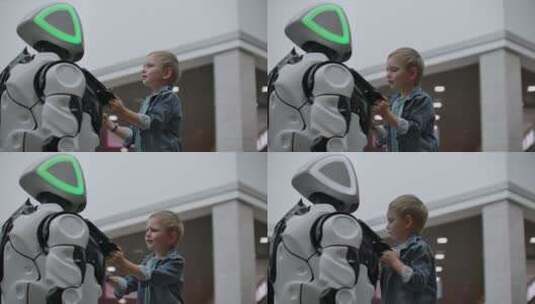 仿人机器人在科技展上与儿童对话高清在线视频素材下载