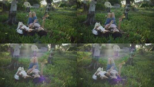 两个女孩躺在草地上高清在线视频素材下载