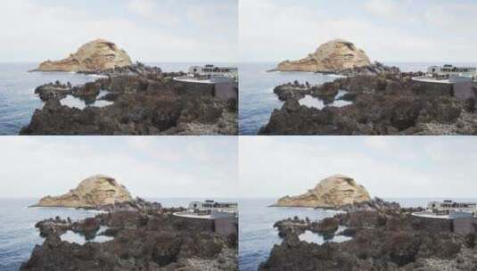 多岩石的海边_有一条小木板路高清在线视频素材下载