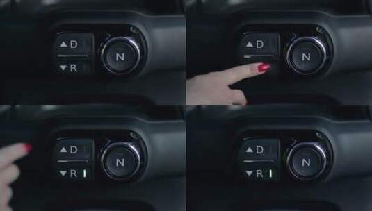 一名女子按下仪表盘上的倒车按钮高清在线视频素材下载