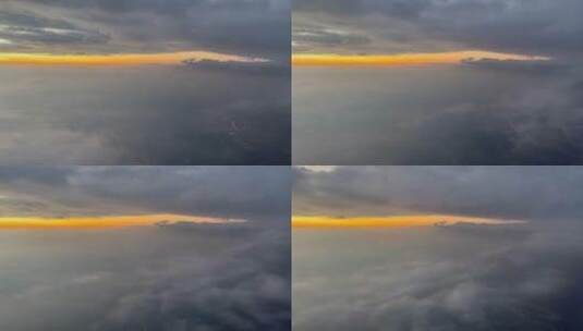 穿越云层的飞机舷窗外的傍晚自然风光高清在线视频素材下载
