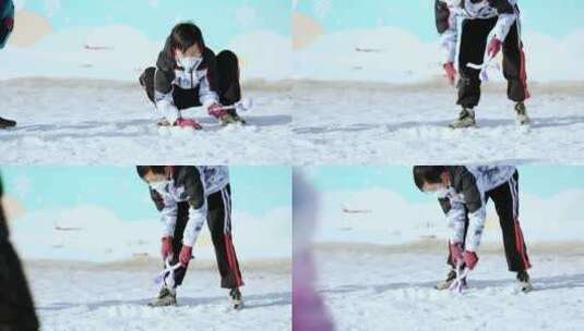 4K升格实拍在雪地里制作雪球打雪仗的男孩高清在线视频素材下载