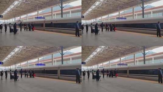 漳州站火车站候车的旅客和进站高铁动车组高清在线视频素材下载