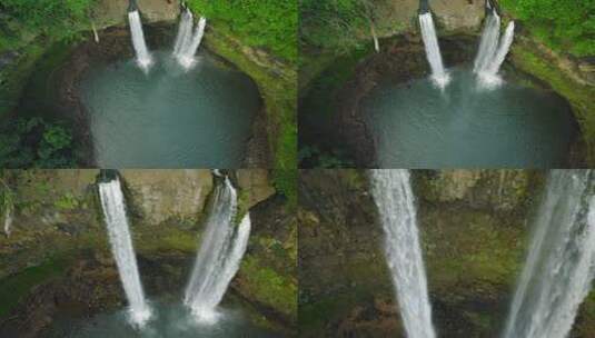 戏剧性的空中推进从宽顶拍摄到夏威夷奥帕卡瀑布的特写镜头。白天。高清在线视频素材下载