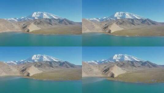新疆山坡下青色湖泊航拍高清在线视频素材下载