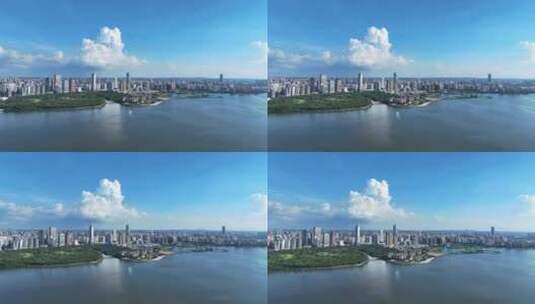 航拍夏季蓝天白云下的海南海口滨海城市风光高清在线视频素材下载