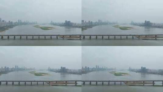 南昌大桥航拍赣江两岸城市建筑风景阴天城市高清在线视频素材下载
