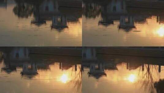 傍晚夕阳照耀下金色的水面倒影形成天然油画高清在线视频素材下载