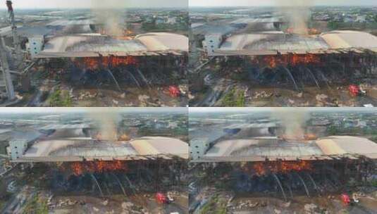 被火焰吞没的大型工业建筑的鸟瞰图。高清在线视频素材下载