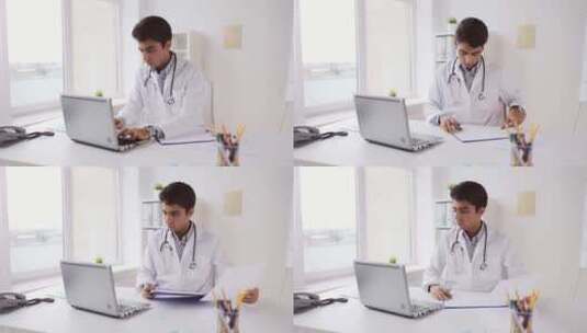 带笔记本电脑和心电图的男医生在医院高清在线视频素材下载