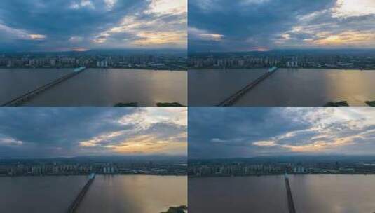 城市高铁跨江大桥日落火烧云延时高清在线视频素材下载
