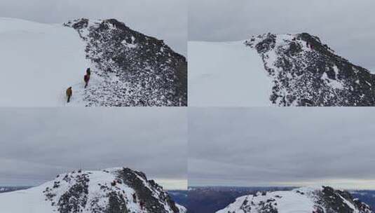 航拍攀登四川岷山山脉雪宝顶雪山的登山队高清在线视频素材下载