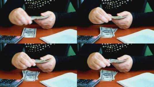 在桌子上数钞票高清在线视频素材下载