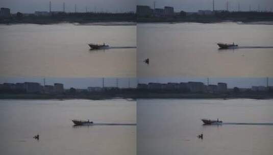 傍晚江上一只渔船驶过河面船只黄昏江河空境高清在线视频素材下载