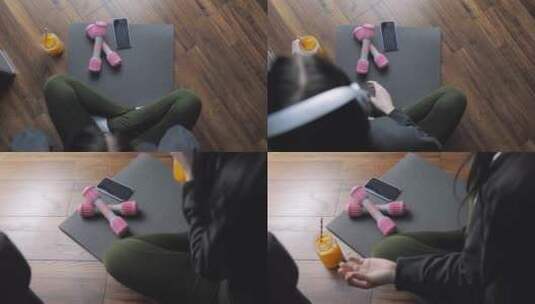 年轻女性锻炼后使用手机高清在线视频素材下载