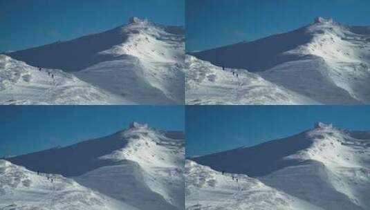 徒步者走在雪山上高清在线视频素材下载