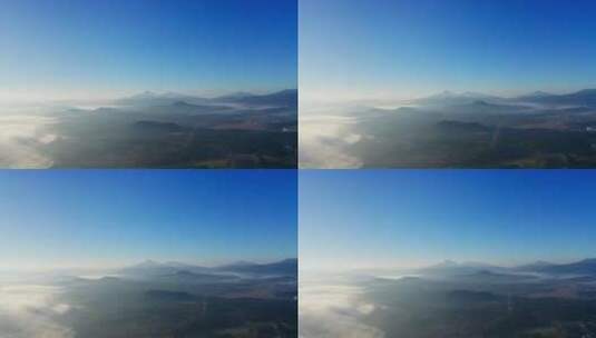 航拍清晨薄雾缭绕的腾冲火山坝子高清在线视频素材下载