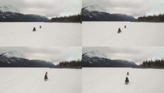 结冰的湖上骑雪地摩托高清在线视频素材下载