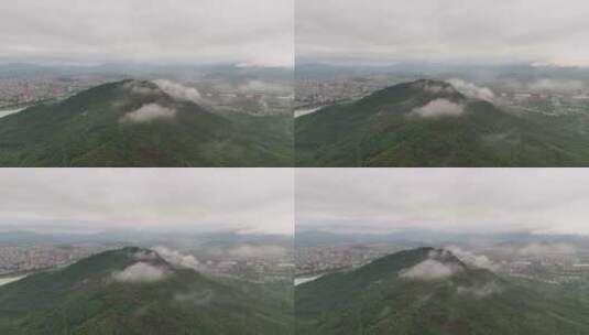 雨雾中的山峰和城市高清在线视频素材下载