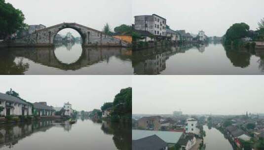 古建筑航拍古镇石拱桥建筑群河流绿水高清在线视频素材下载