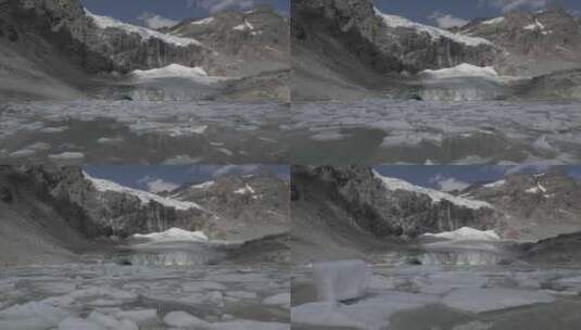 航拍雪山脚下冰冻的溪流高清在线视频素材下载