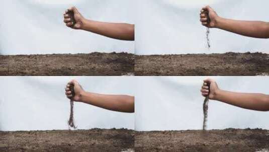 手握并撒下肥沃的土壤高清在线视频素材下载