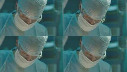 外科医生在看监视器高清在线视频素材下载
