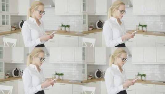 女人在厨房使用手机高清在线视频素材下载