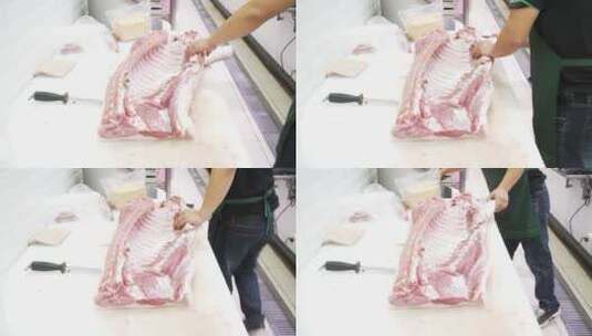 现代商超生鲜工作人员切割猪肉高清在线视频素材下载