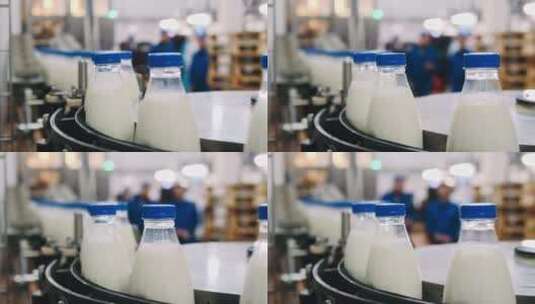 奶厂将奶制品倒入塑料瓶的输送线高清在线视频素材下载