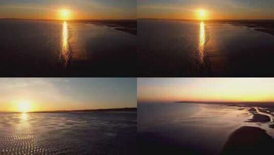海上落日夕阳沙滩海岸滩涂浪花航拍高清在线视频素材下载