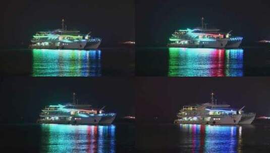 海南三亚夜晚凤凰岛海面游艇船只倒影夜景高清在线视频素材下载