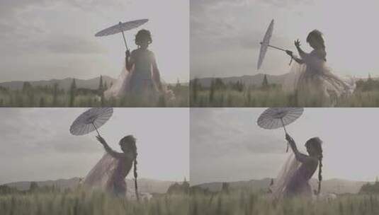 古风女子田野持伞背影高清在线视频素材下载