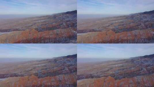 傍晚山坡丹霞沟壑残雪高清在线视频素材下载