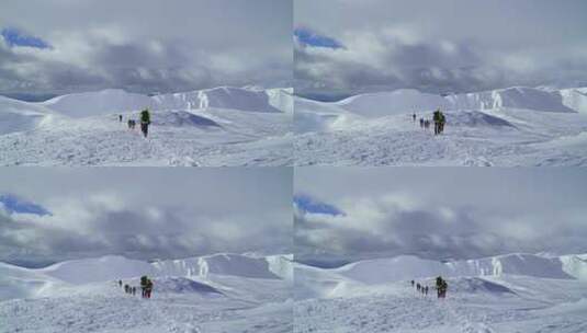 雪山上徒步的旅行者高清在线视频素材下载