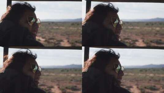 在沙漠自驾游哦欣赏风景的女人特写高清在线视频素材下载
