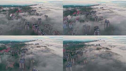 航拍云雾中的城市建筑高清在线视频素材下载