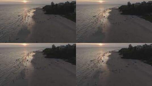 夕阳下的涠洲岛海滩人群高清在线视频素材下载