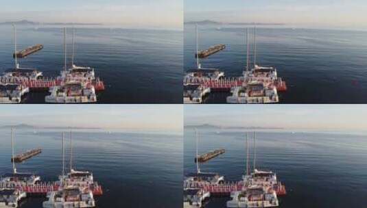 航拍沿海城市海岸线日出渔船风光高清在线视频素材下载